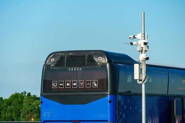 A close-up shot of an autonomous truck's sensor array, highlighting LiDAR, radar, and camera technology, set against a blurred backdrop of a busy highway during daylight.