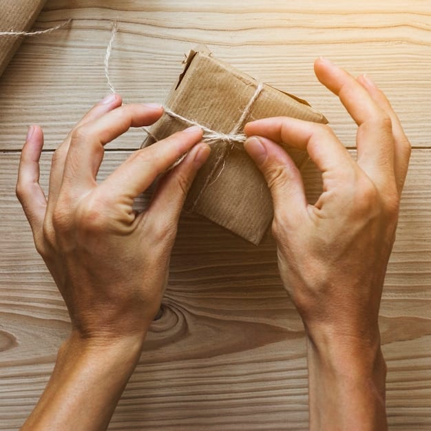 A close-up shot of a hand placing biodegradable packing peanuts into a cardboard box, surrounding a fragile item being prepared for shipping in a US warehouse.