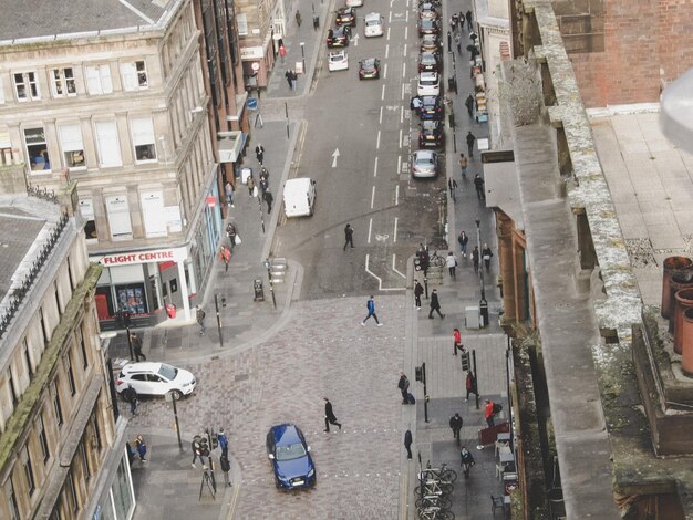 A crowded city street with cars stuck in traffic, contrasted by a dedicated bike lane with cyclists smoothly moving through the congestion. This highlights the efficiency of bikes in reducing urban traffic.