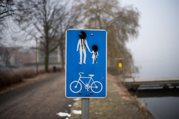 A sign indicating designated bike lanes and the prohibition of e-scooters on sidewalks. The sign is clear and visible in an urban setting with pedestrians and cyclists nearby.